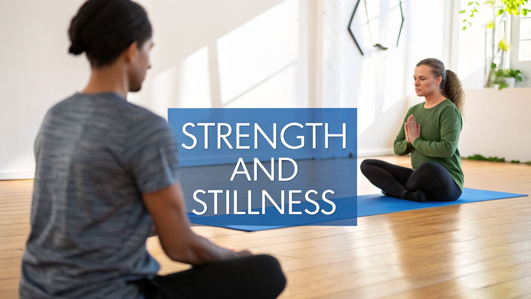 Two people meditating in a bright yoga studio, embodying strength and stillness.