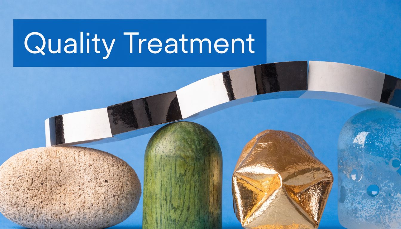 A bridge made of black and white panels rests on top of stones and various objects against blue background.